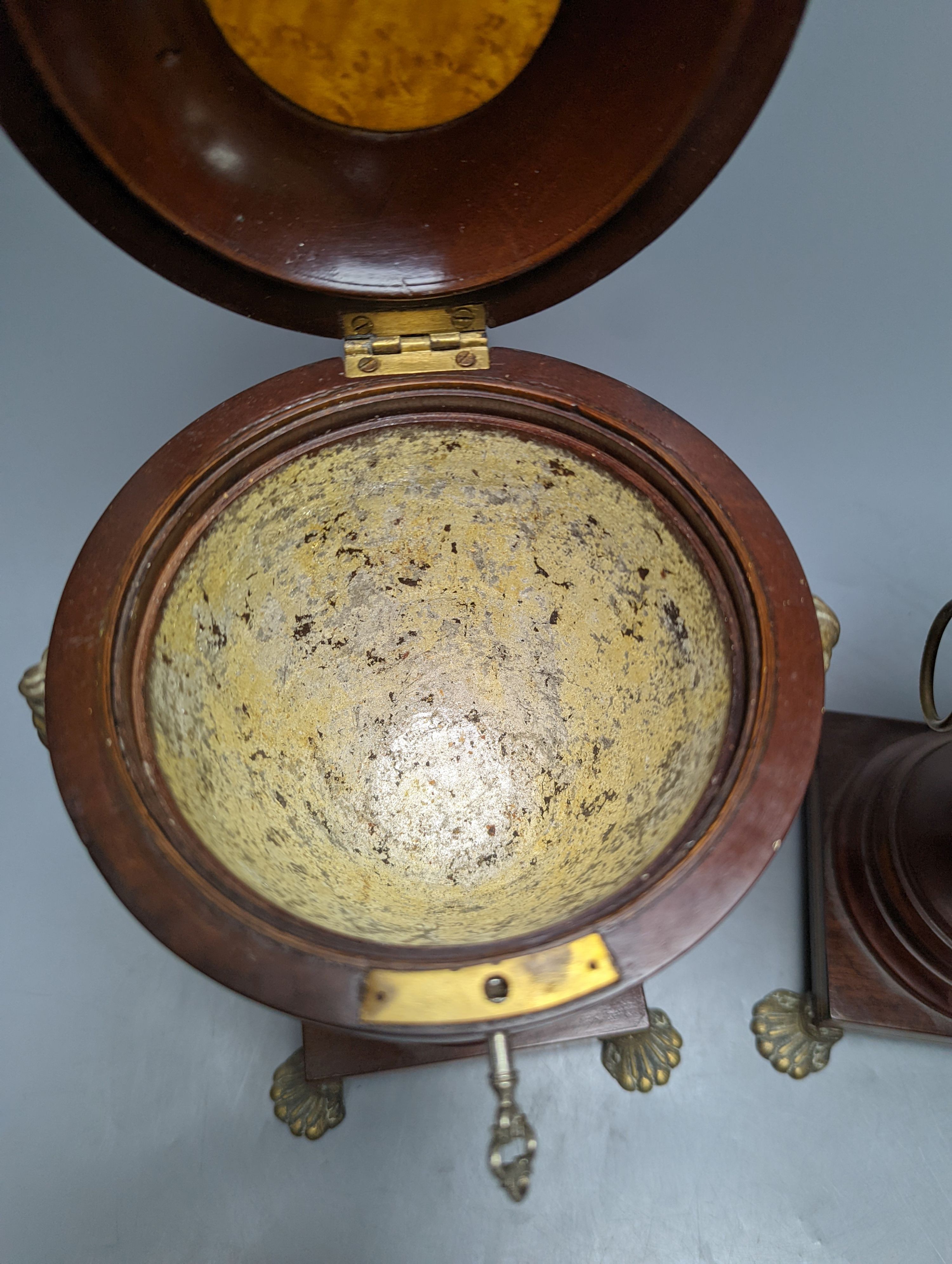 A pair of Sheraton-style mahogany urn-shape tea caddies, with brass mounts, 36cm.